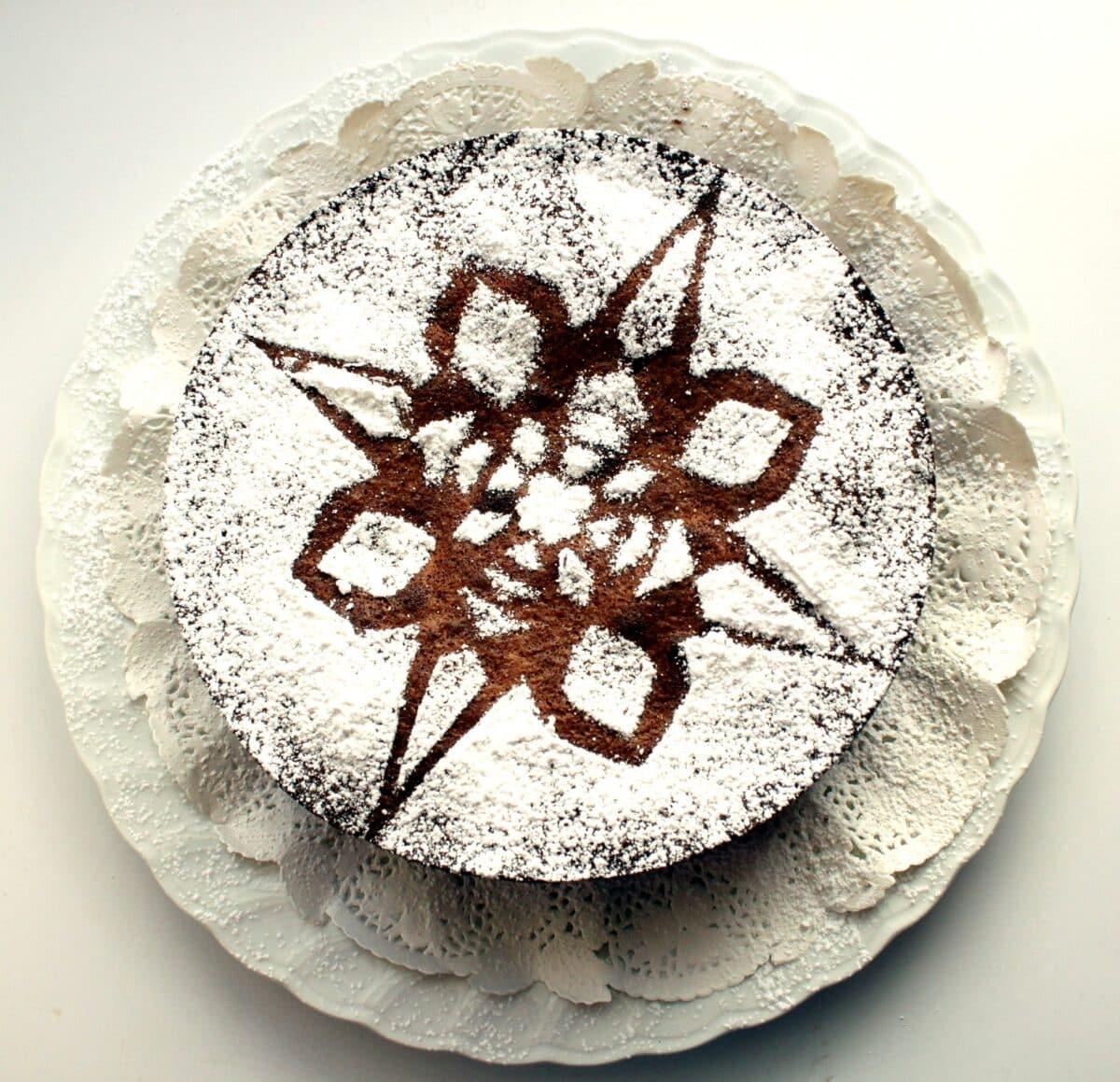 Gluten-free chocolate cake with powdered sugar design