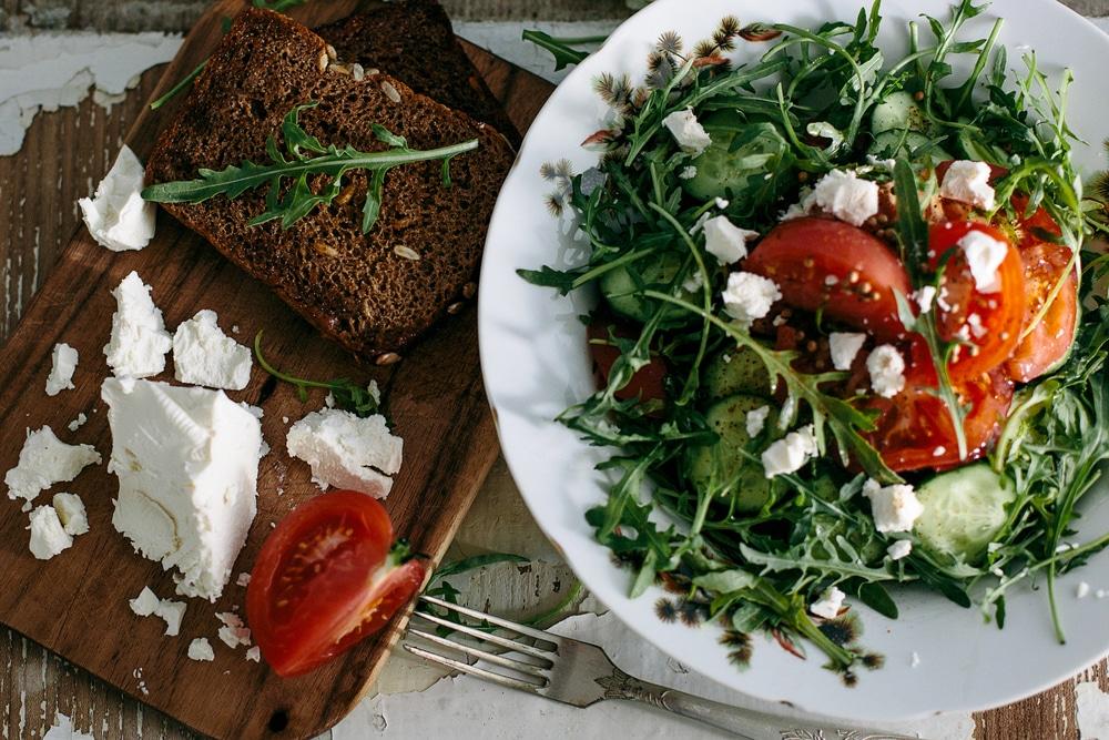A vibrant spring vegetable salad with cucumber, mint, and snap peas