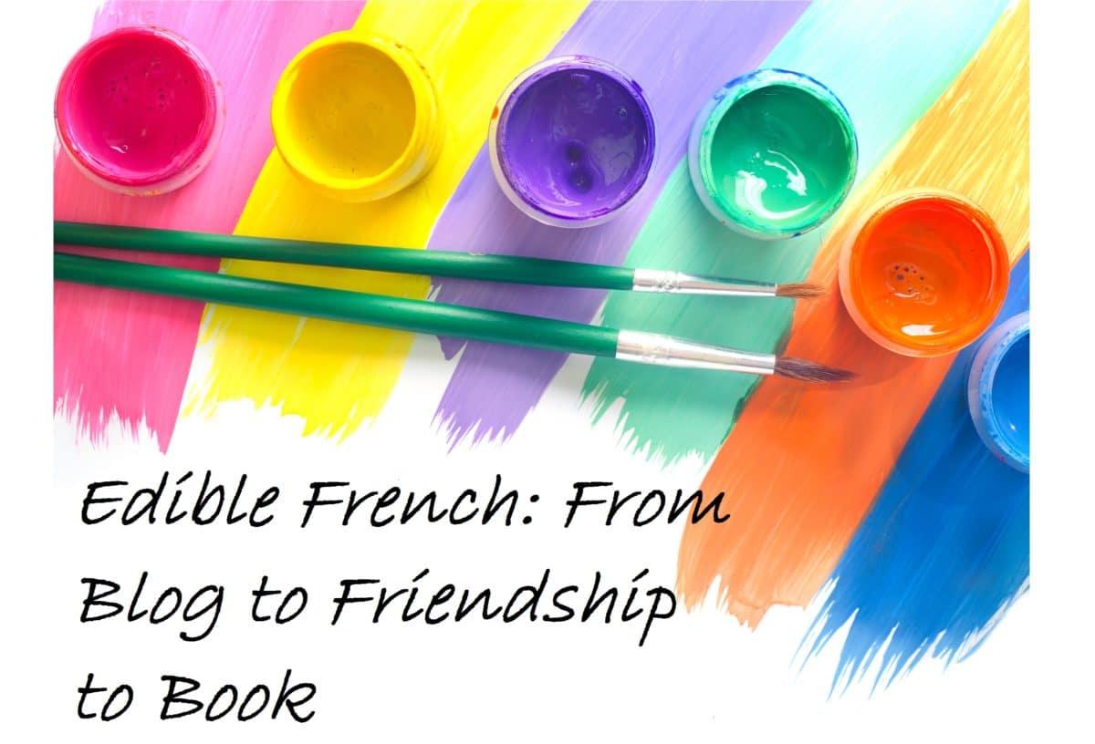 Colorful paint pots with brushes on a bright multicolored background
