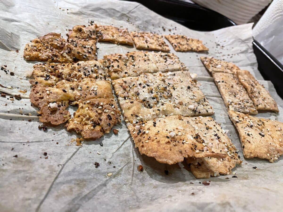 Homemade sourdough crackers on parchment