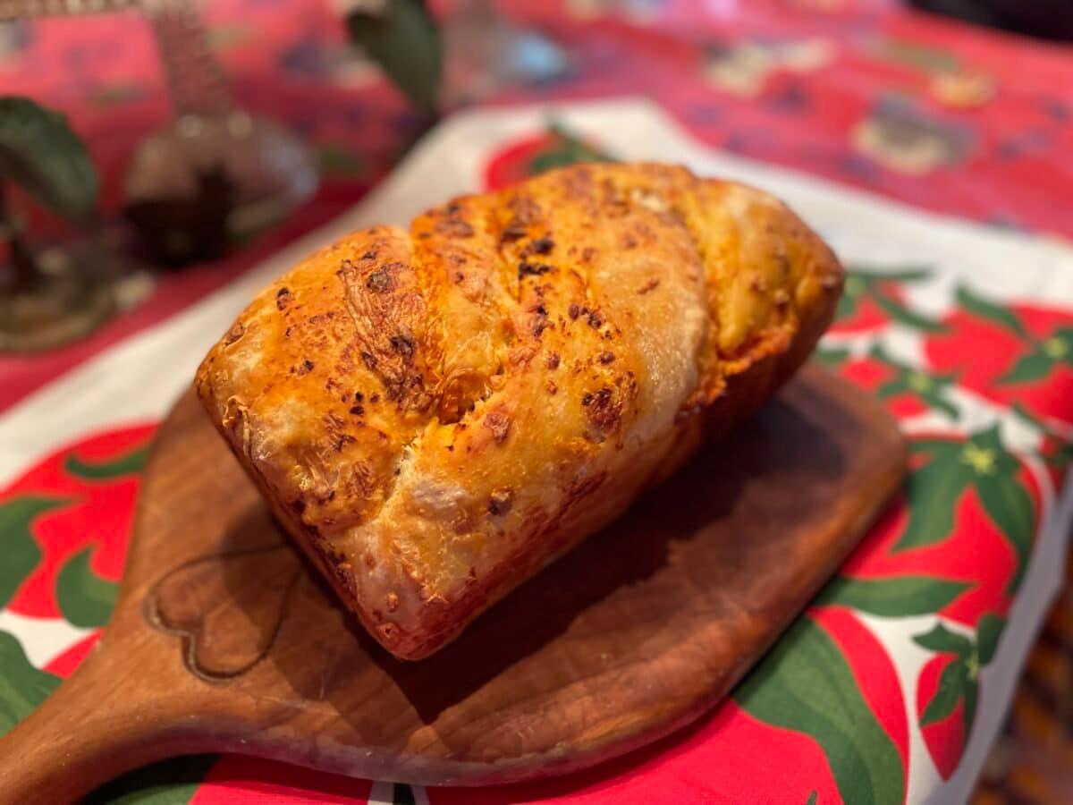 tomato cheese sourdough babka on a tomato patterned cloth